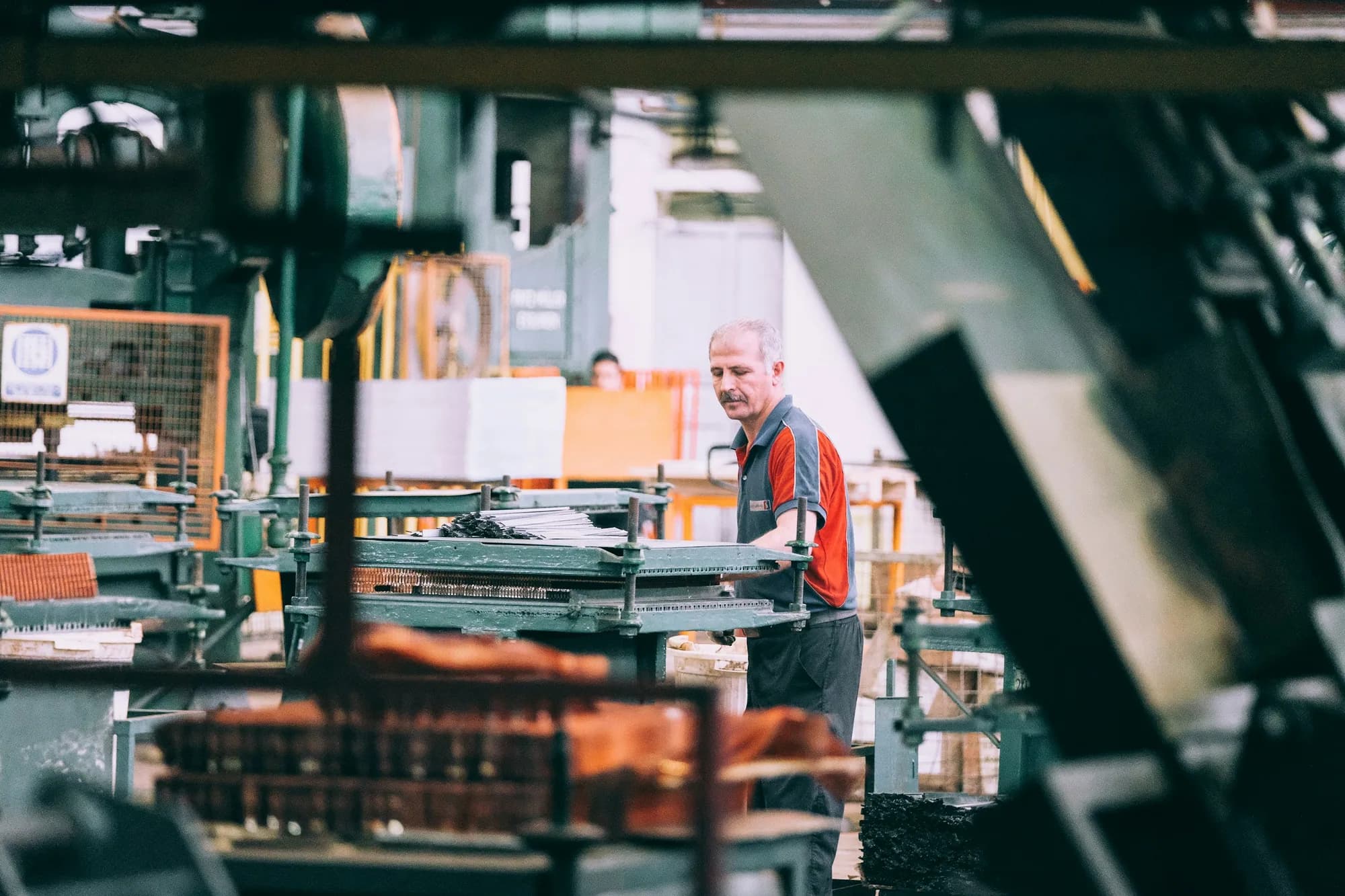 An experienced manufacturing worker on a production floor